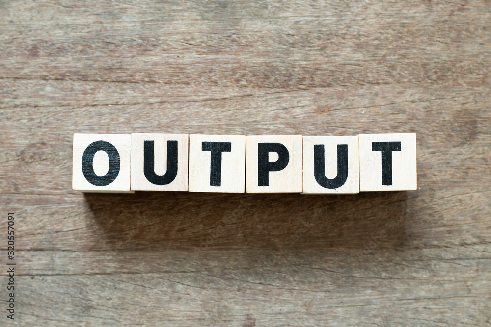 Fototapeta premium Letter block in word output on wood background