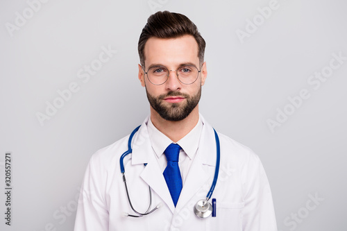 Close-up portrait of his he nice attractive calm smart clever intelligent doc professor first aid help emergency assistance center isolated on light white gray pastel color background