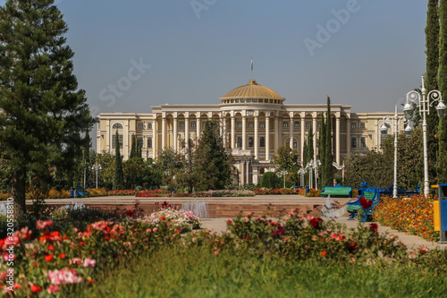 View of the presidential palace in Dushanbe through flowers of the garden, Tajikistan
