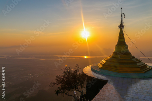 Sunset with mountains in the background the stupa of Myanmar