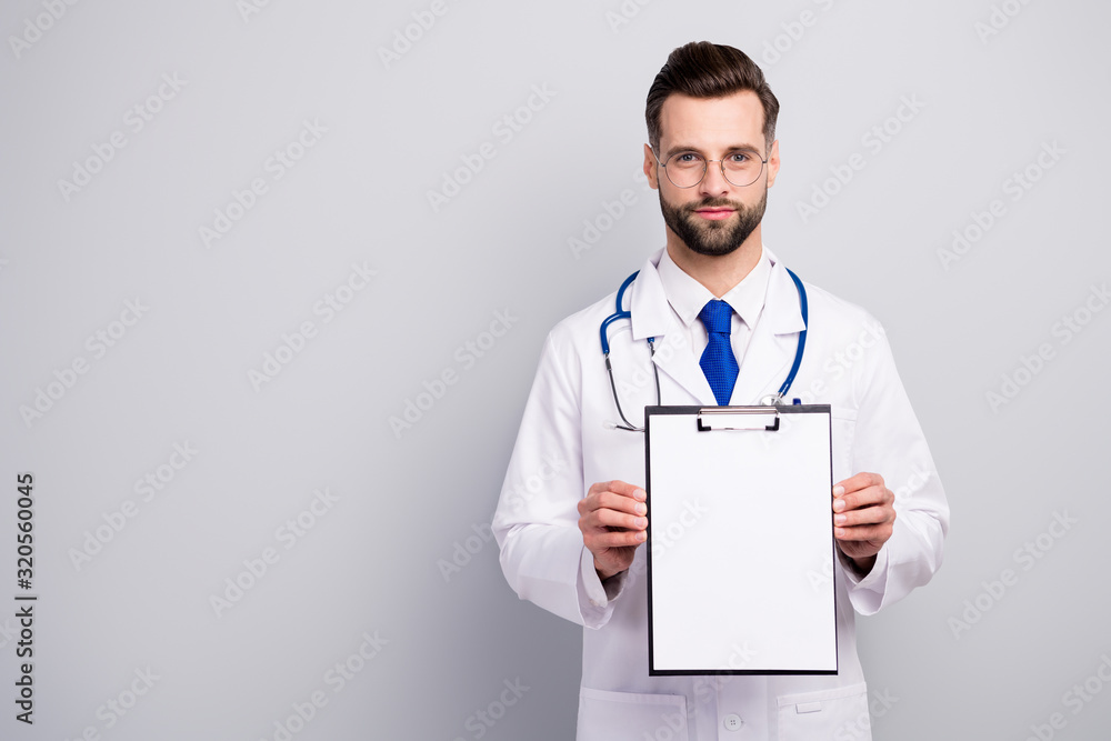Portrait of his he nice attractive content bearded doc showing blank empty copy space paper document contract insurance medicare first aid help assistance isolated on light white gray pastel color Portrait of his he nice attractive content bearded doc showing blank empty copy space paper document contract insurance medicare first aid help assistance isolated on light white gray pastel color