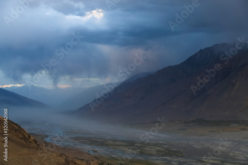 The valley of the Pyandzh River at dawn in the rays of the rising sun, on the border with Avganistan