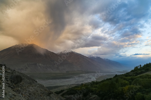 The valley of the Pyandzh River at dawn in the rays of the rising sun, on the border with Avganistan