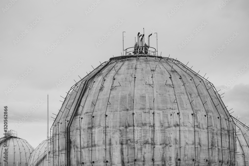 Fototapeta premium Details of old gas tank of spherical form, black and white.