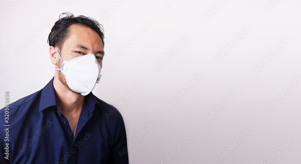 Businessman wearing protection mask on white background. Business man wear N95 mask because of pm2.5 air pollution, carbon dioxide and coronavirus fever. Conception of Healthcare. Protect body. Businessman wearing protection mask on white background. Business man wear N95 mask because of pm2.5 air pollution, carbon dioxide and coronavirus fever. Conception of Healthcare. Protect body.
