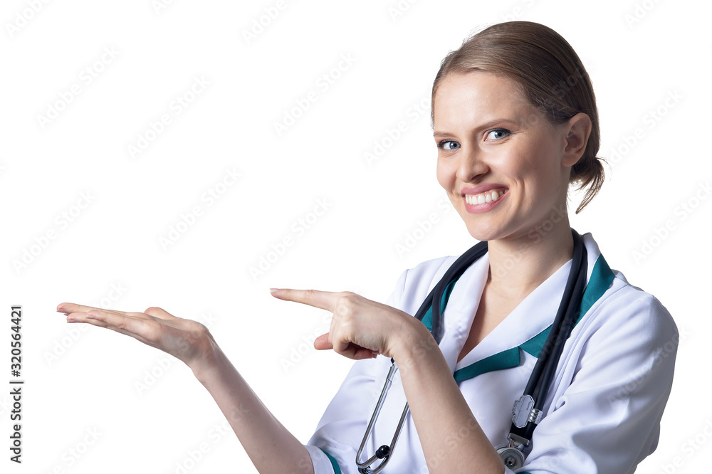 Portrait of female doctor pointing to the left on white Portrait of female doctor pointing to the left on white