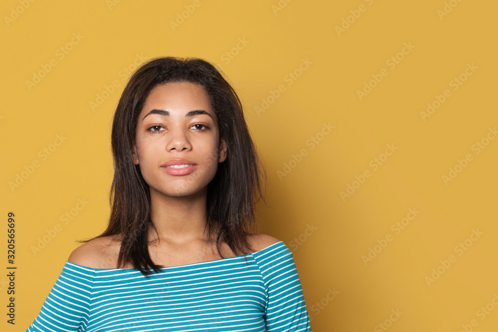 Beautiful African American woman on yellow background Beautiful African American woman on yellow background
