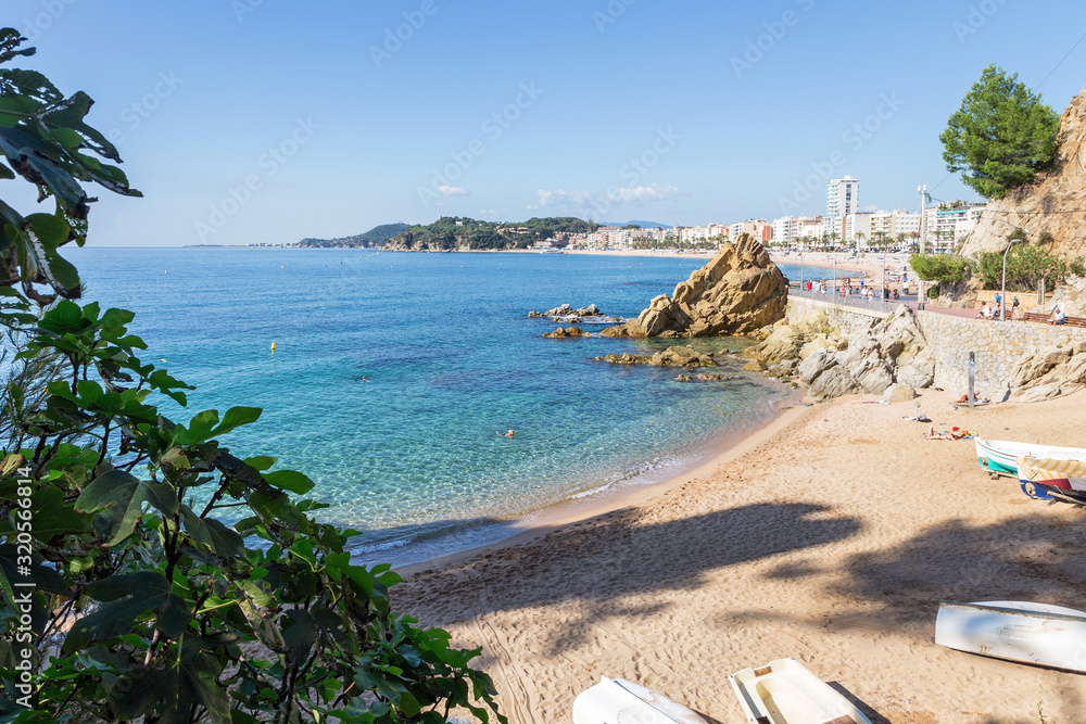 View of the embankment and the beach of the resort town of Lloret de Mar, Costa Brava, Spain
