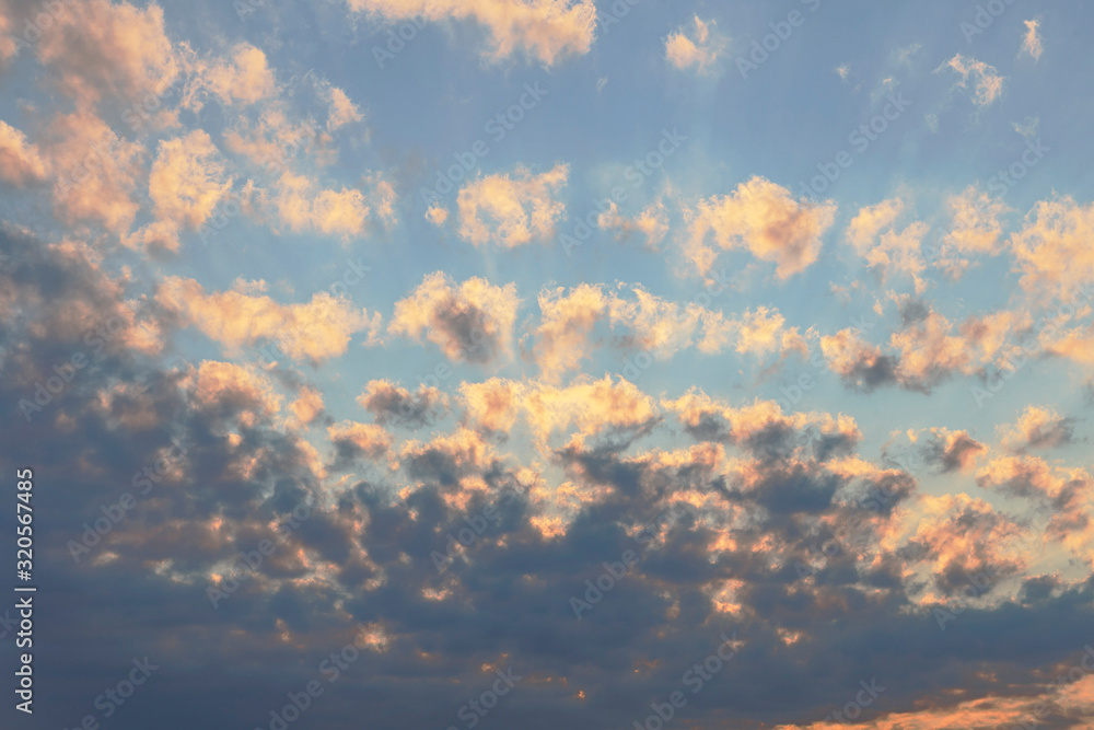 evening sky with beautifully sunlit clouds as a natural background