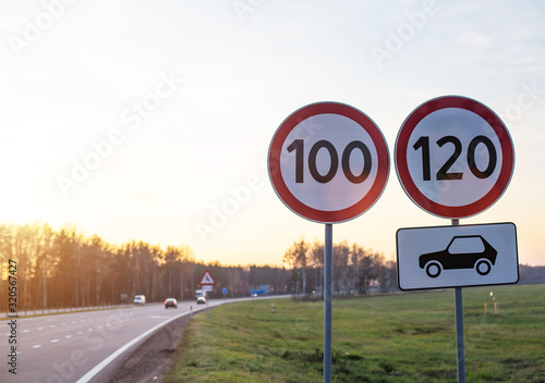 Traffic signs limit the maximum speed on the motorway. Speed and Safety Compliance Concept, copy space