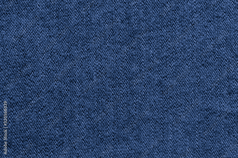 Blue natural texture of knitted wool textile material background Blue natural texture of knitted wool textile material background