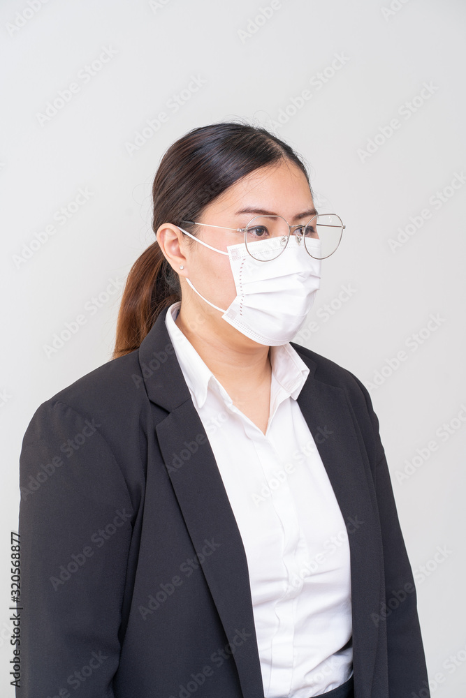 Asian women wearing surgical face mask to prevent flu disease Corona virus and PM 2.5 dust