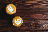 two cups of coffee on vintage wood. Top view , cup on wooden table. View from top