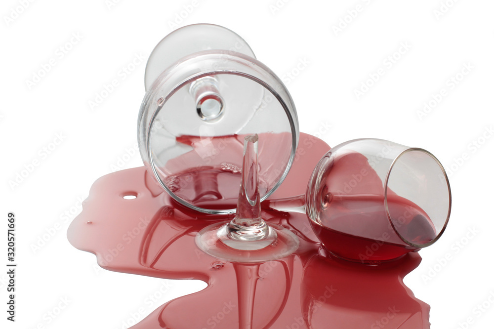 Broken glass with red wine. Isolated object on a white background