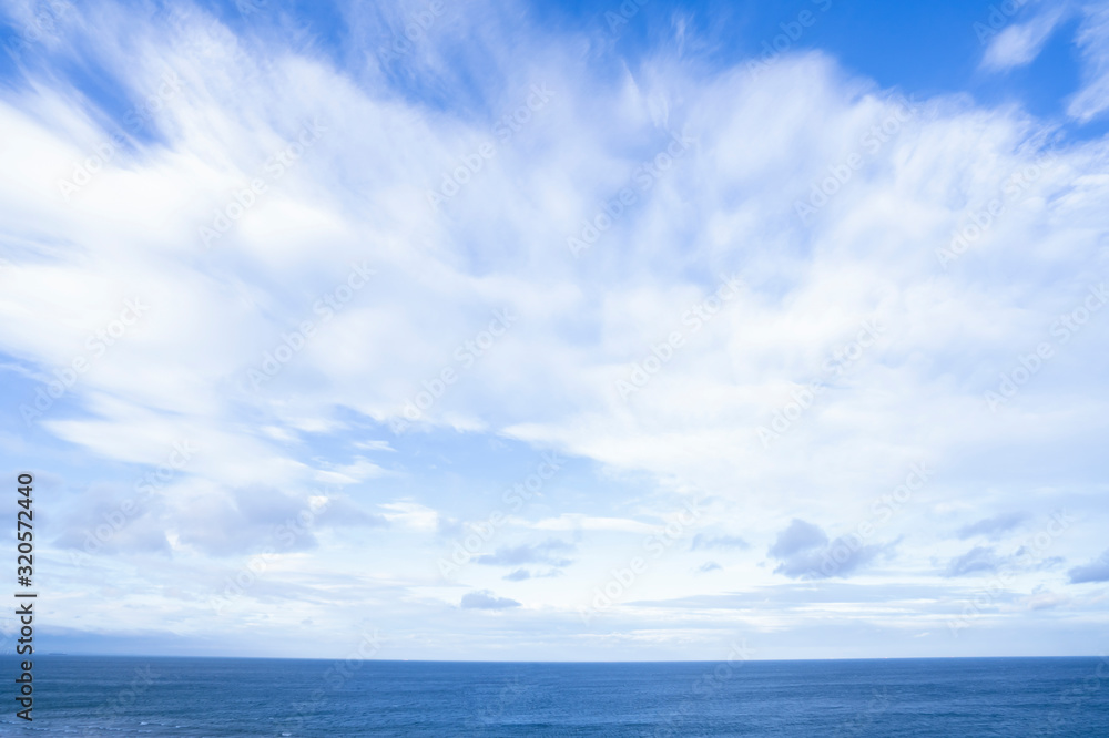 Seascape with sea horizon and beautiful  sky line with clouds. Blue Ocean and sea with white cloud on blue sky in spring or summer