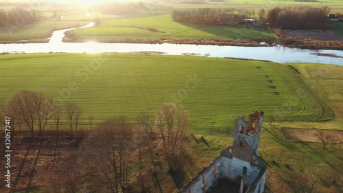 Ruins of the Lutheran Church in Salgale Latvia Near of the Bank of the River Lielupe Aerial View photo