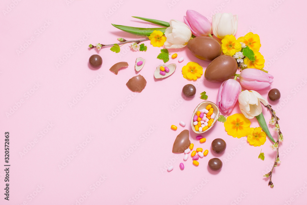 Easter pink background with eggs and flowers