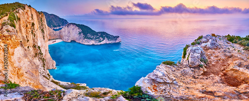 Navagio Beach with shipwreck view on Zakynthos island, Greece. Incredibly romantic sunrise on Zakinthos. Amazing sunset view with multicolored clouds. Island of lovers. Doors to heaven
