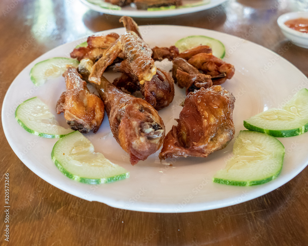 Selection of burmese dishes in rural Myanmar with skinny chicken and traditional soup