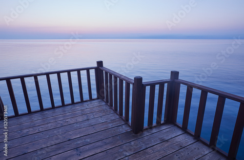 Atlantic ocean - beautiful seascape sea horizon and blue sky  natural photo background. Still calm sea water surface. Abstract fence to the sea. No line to horizon.