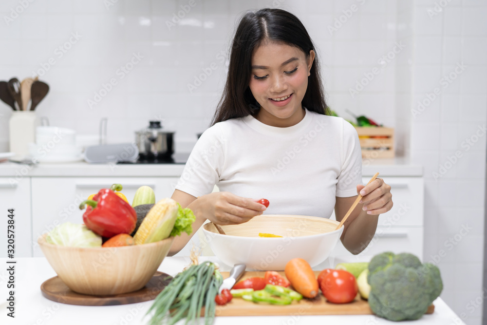 Eat healthy food for good wellness health concept. Woman cooking salad menu with fresh organic vegetables