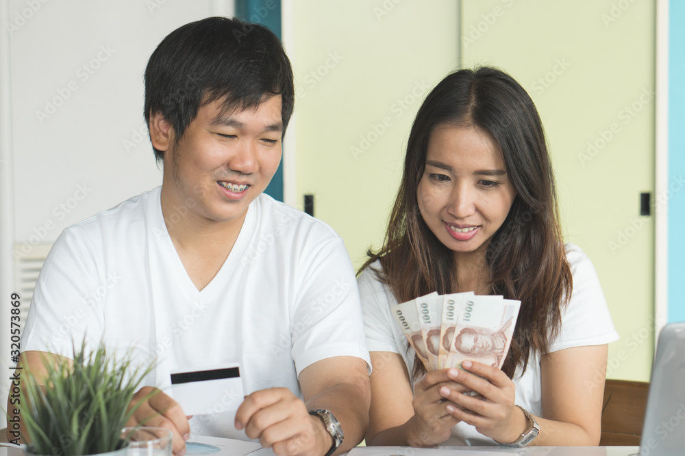 Freedom of financial. Happy asian couple enjoying with cash after free from credit card debt. Freedom of financial. Happy asian couple enjoying with cash after free from credit card debt.