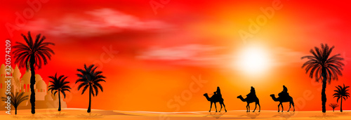 Camel riders on sunset background. Camel riders in a sandy desert. Caravan on a sunset background. Palm tree
