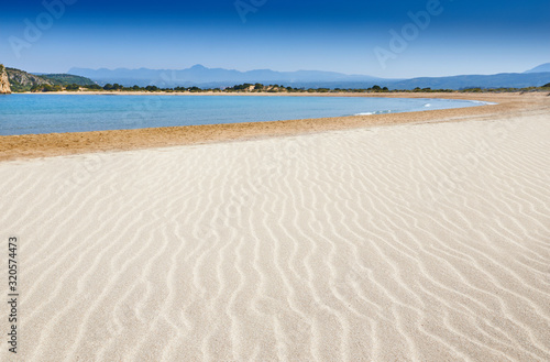 Fototapeta Naklejka Na Ścianę i Meble -  Amazing sunset view with multicolored clouds. Incredibly romantic sunrise on Voidokilia beach, Ionian Sea, Pilos town location, Greece, Europe. View of the ocean. Tropical beach