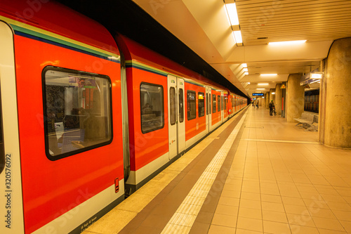 Underground train in subway metro station in Germany with less passenger