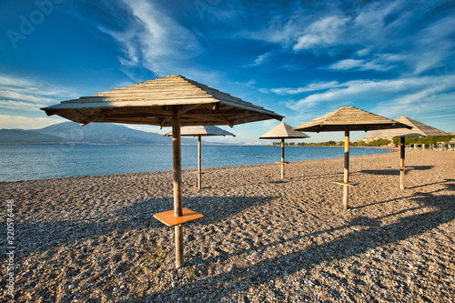 Amazing sunrise. First warm days on the Nafpaktos beach. Vacation concept background. Sunny spring seascape of Corinth Gulf. Splendid morning scene of Greece resort. . © zicksvift