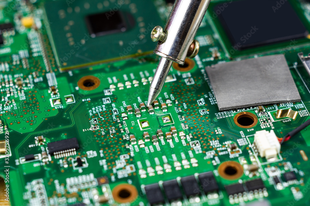 soldering iron for repairing electronic of the computer circuit board concept technology of computer circuit hardware soldering iron for repairing electronic of the computer circuit board concept technology of computer circuit hardware