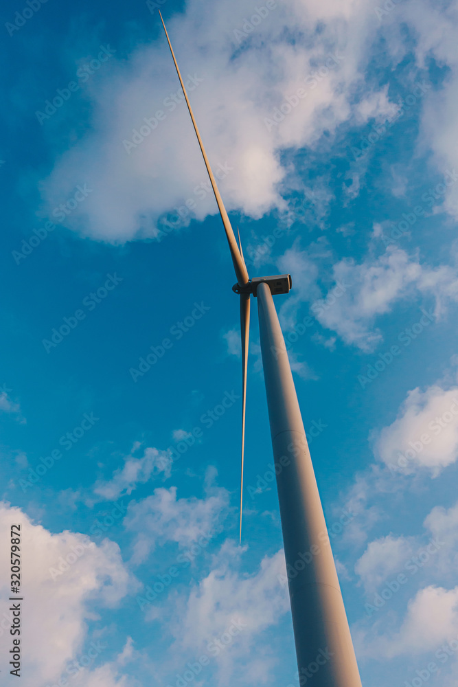 Wind Turbine in Wind farm with the blue sky for future energy Wind Turbine in Wind farm with the blue sky for future energy