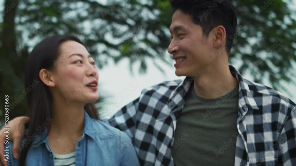 Handheld view of Vietnamese couple spending time together outdoors. Shot with RED helium camera in 8K Handheld view of Vietnamese couple spending time together outdoors. Shot with RED helium camera in 8K