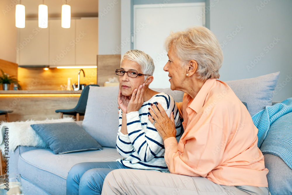 Senior woman comforts her friend supporting her in difficult time showing love attention and care, helping with problem, express empathy news about disease concept. Senior woman comforts her friend supporting her in difficult time showing love attention and care, helping with problem, express empathy news about disease concept.
