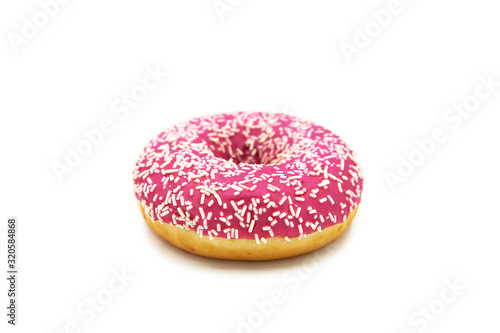 Donut with pink icing and white sprinkles isolated on white background. 