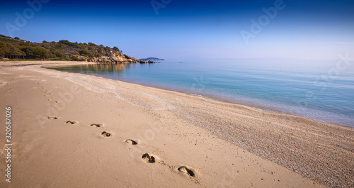 Fototapeta Naklejka Na Ścianę i Meble -  Amazing sunset view on Proti ammoudia beach near Olympiada town summer resort, Kavala region, Greece.. Incredibly romantic sunrise on the beach, Ionian Sea. View of the ocean. Tropical beach