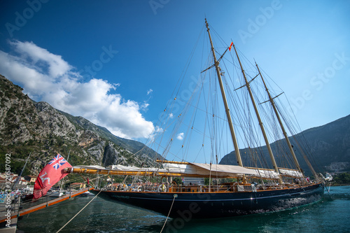 Big Ship with sails in the bay. Great Sailing Yacht. Kotor Bay, Montenegro. Vacation in Europe