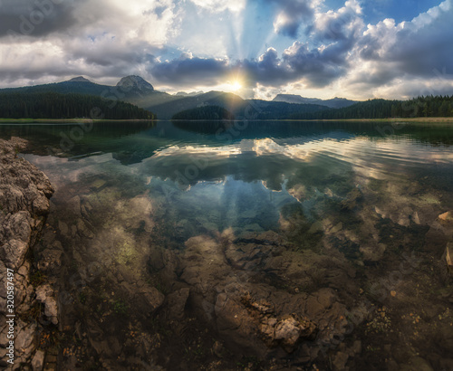 Black lake (Crno jezero) summer cloudy evening sunset landscape. Zabljak Municipality, Montenegro. photo