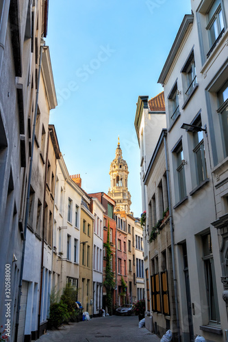 Antwerp, Belgium. Street overlooking the bell tower of Saint Carolus Borromeus Church photo