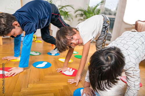 Group of Children Playing Twister Indoors photo