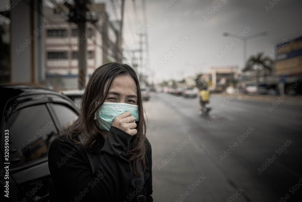 Fototapeta premium Asian traveler woman wear mask for protect coronavirus,Thai woman wearing face mask respiratory protect and filter pm2.5 (particulate matter)