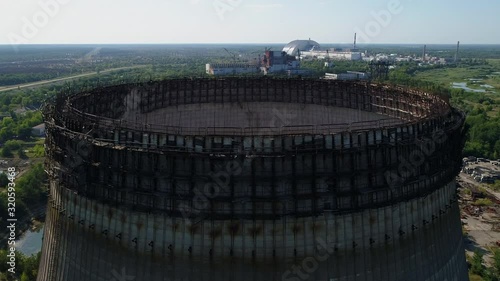 Aerial view of the top of unfinished cooling tower for the fifth and sixth nuclear reactors of third stage of Chernobyl nuclear power plant. Exclusion Zone. 4K drone footage