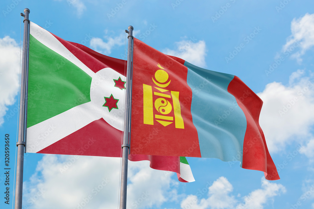 Mongolia and Burundi flags waving in the wind against white cloudy blue sky together. Diplomacy concept, international relations. Mongolia and Burundi flags waving in the wind against white cloudy blue sky together. Diplomacy concept, international relations.