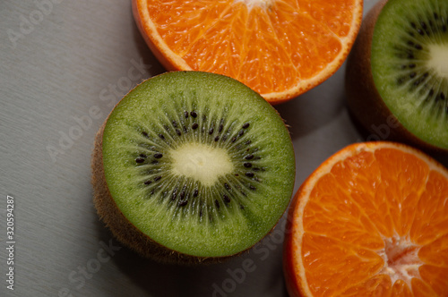 kiwi and orange on white background