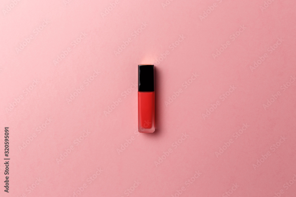 Red lipstick on a pastel pink background. Promotion of luxury fashion cosmetic brand. The concept of fashion and beauty. Top view. Flat lay. Copy space. Fashion blog design Red lipstick on a pastel pink background. Promotion of luxury fashion cosmetic brand. The concept of fashion and beauty. Top view. Flat lay. Copy space. Fashion blog design