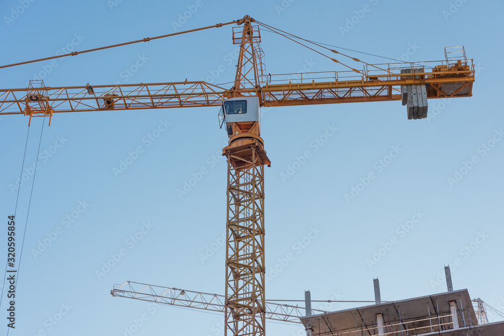 Construction site with high-rise construction cranes. Construction site with high-rise construction cranes.