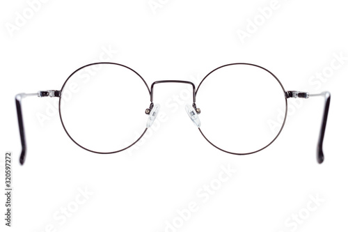 The back view of a black metal round medical eye glasses isolated on a white background