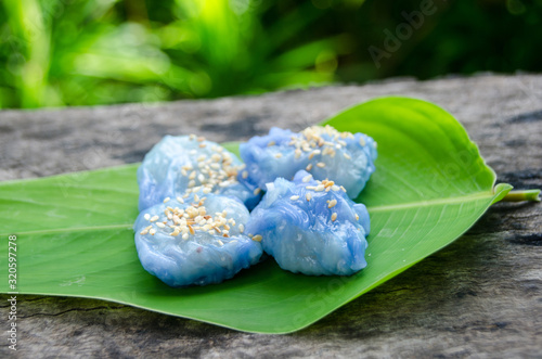 Thai steamed rice-skin dumplings. kind of Thai snack on the leaf with old wold table Thai food