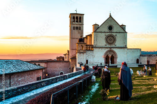 winter sunset at the Saint Francis church in assisi (italy) photo