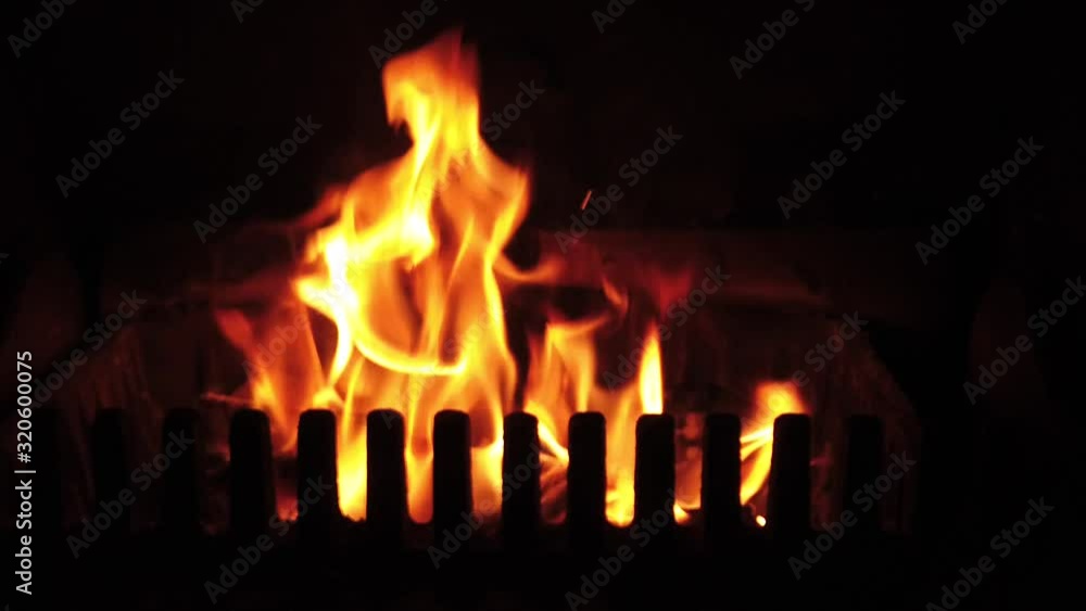 Slow motion flames from a fireplace stove Slow motion flames from a fireplace stove